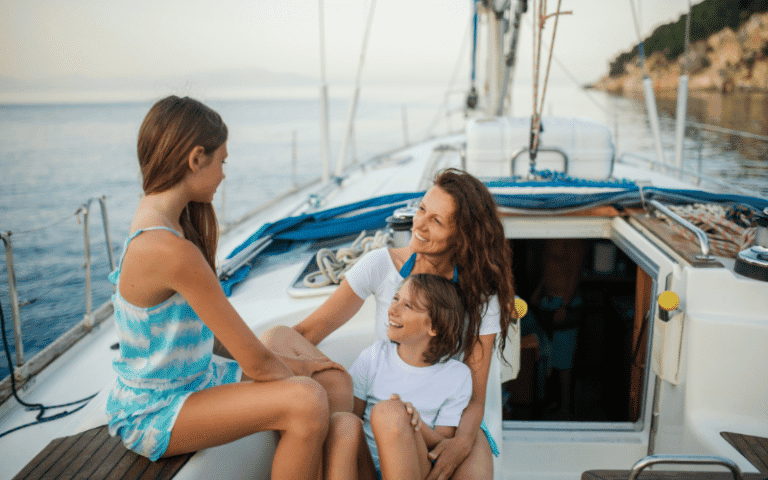 Children sailing on calm waters, following safety tips. Sunny day, clear blue sky, and gentle breeze. Brightly colored sailboats and happy kids